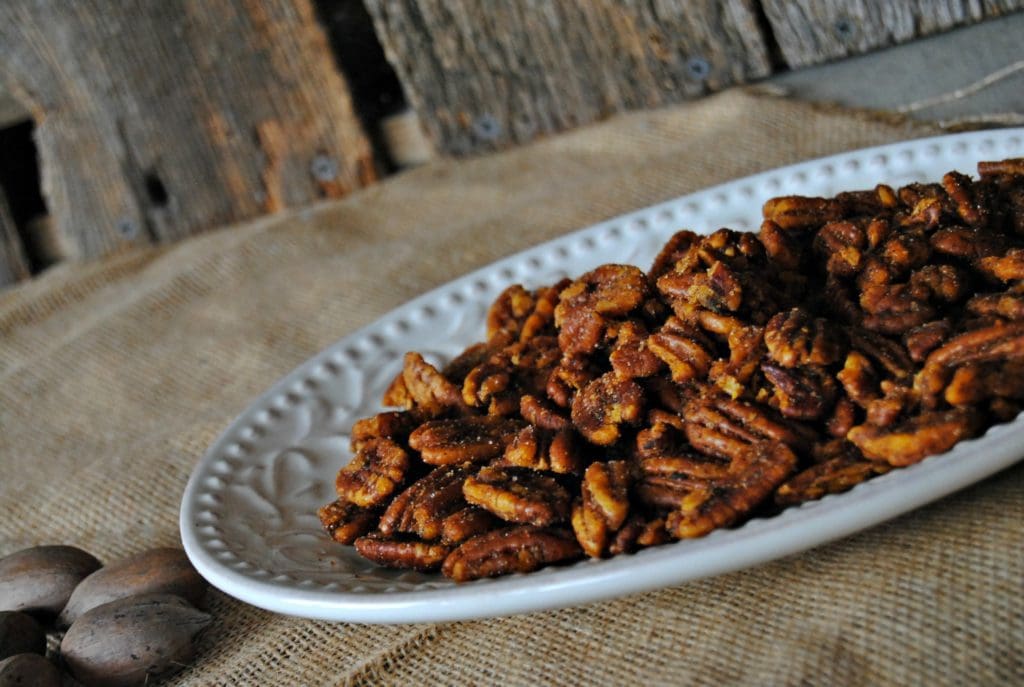 Close up of Cajun Spiced Pecans on a white plate